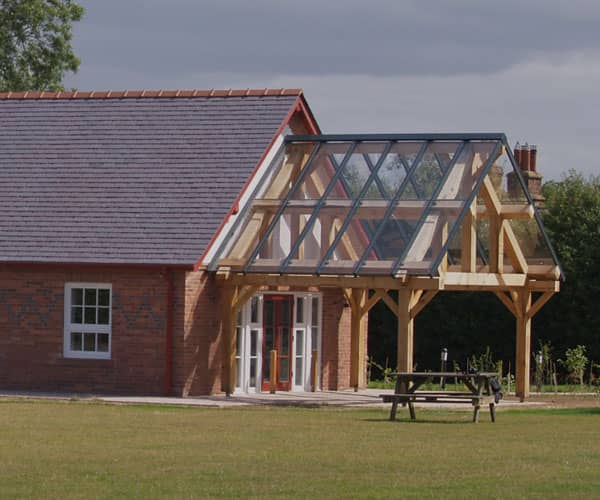 School with modern glass roofed entrance